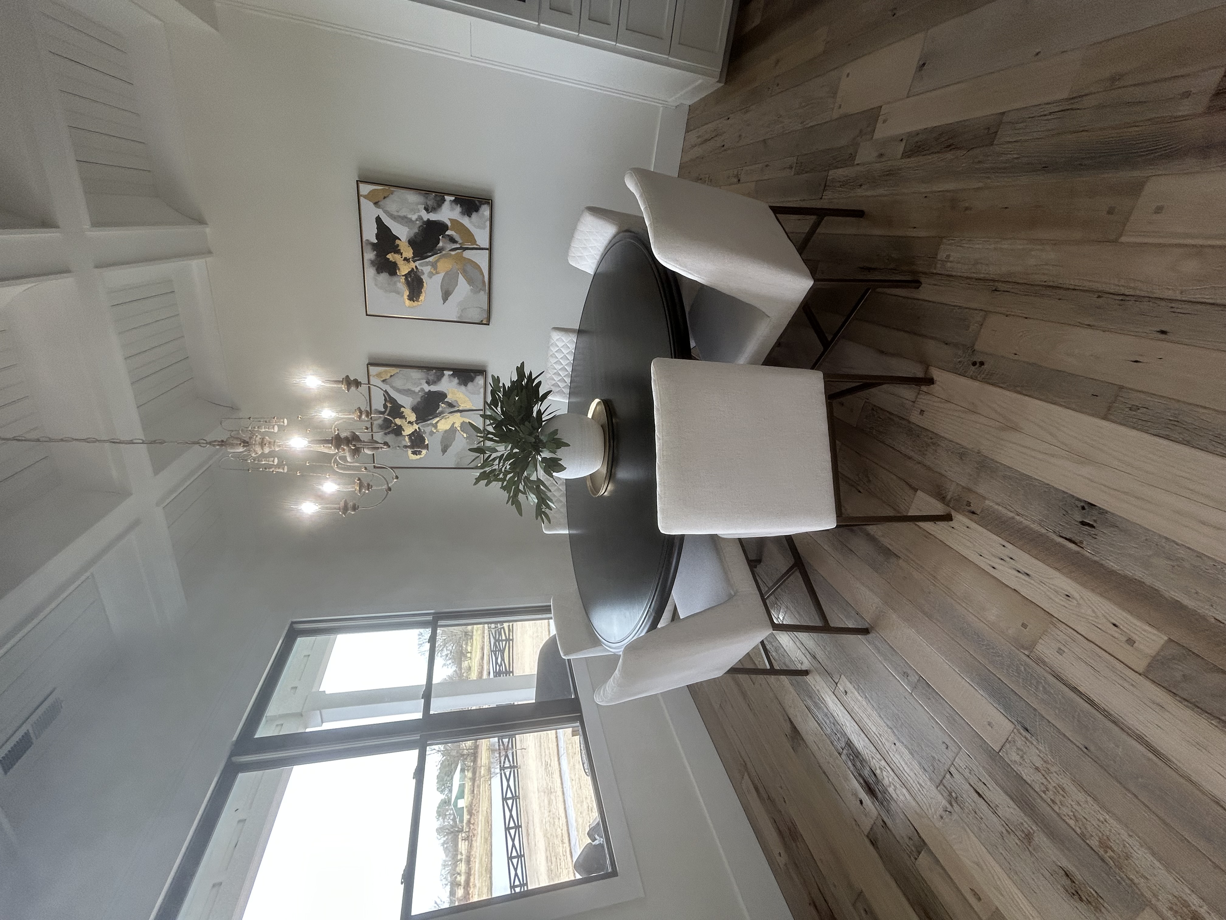 A styled, organized dining room with fresh greenery and natural light